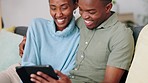 A couple streaming a movie, on the phone and in their home, having fun and laughing. Young, black and loving couple using smartphone to watch movies and videos. Laugh, love and spending time together