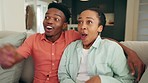 Excited black couple watch television, movies and comedy media on subscription streaming service in relax living room at home. Smile, laughing and happy people connect to funny cable tv show together