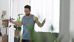 Fitness, jump rope and man doing cardio exercise at home in the living room for an endurance training workout. Young, performance and healthy athlete jumping in his house for an energy challenge