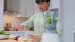 Health smoothie, vegan diet and woman with healthy food making a detox drink in kitchen with organic ingredients and fruit. Happy nutritionist female with shake for weight loss, energy and wellness