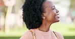 Happy, freedom and laughing with young black woman enjoying nature, lifestyle and calm day. Vision, peace and smile with girl standing in outdoor park walk for motivation, happiness and success