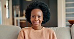 Black woman, afro and laughing on house living room sofa as new homeowner with mortgage loan, real estate finance and property investment. Portrait, smile or comic person with happy mindset in rental