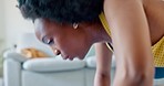 Fitness exercise, tired breathing and black woman doing workout in living room, training for health and body goals in lounge of house. African girl with commitment doing cardio pushup for wellness