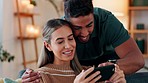 Couple phone, love kiss and relax on social media mobile app, communication about meme on internet and smile for comic video on the web in house. Man and woman happy with smartphone on the sofa