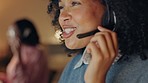 Call center, telemarketing consultant and late night working on computer for customer service with headset and typing on computer keyboard in office. Contact us and CRM woman do research on database