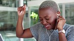 Employee, earphones and listening to music while dancing in an office. Happy, excited and black woman with smile receives good news on her mobile device in corporate business building at work