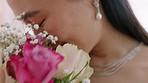 Happy, smile and asian bride with flowers in wedding dress at marriage, reception or celebration. Joyful, excited and nervous bride smelling pink and white bouquet on wedding day with happiness.  