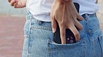 Woman, phone and casual jeans pocket while standing outside and sliding smartphone in pants for accessible, convenience and communication. Closeup of female from behind with 5g network connection