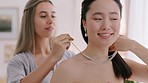 Wedding, jewelry and diamond with a bride getting ready for a marriage ceremony or celebration event with her bridesmaid. Love, friends and tradition with a young woman and her friend feeling happy