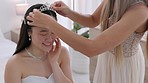 Wedding, happy and smile of a bride with a tiara and bridesmaid ready for her marriage ceremony in a room. Happiness, love and beautiful asian woman in elegant bridal garment for event or celebration