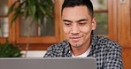 Asian man, laptop or success idea in home office or house living room for digital marketing, web design or business software. Smile, happy or motivation remote worker or freelancer with technology ux