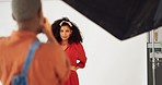 Photography, photographer and model black woman in fashion backstage clothes photoshoot in studio. Influencer, gen z girl posing for her marketing portfolio or catalog in professional creative career
