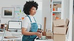 Startup, delivery and shipping in boxes for online shopping business. Businesswoman packing products from online business in a box to ship to clients and buyers. Black woman working in the office