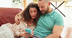 Couple, relax and on sofa with cellphone on social media, watch funny videos and chatting in living room together at home. Happy, man and woman on couch in lounge talking, smile and browse online. 