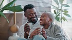 New home, coffee and black couple about moving into a house together with husband relaxing and talking with wife. Proud black woman with her lovely African partner before packing the furniture boxes