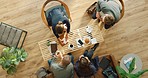 Top view, startup and business people in a meeting planning a marketing, advertising and development strategy. Teamwork, collaboration and corporate group talking, working and writing agenda notes