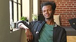 Man, thinking and smile at window, in house or apartment with sunshine. Black man, happy and calm in home looking outside, brainstorming and contemplating new idea, goal or vision for his life