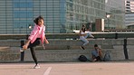 Dance challenge, fitness and city fun with a woman and friends dancing, active and training for competition on urban bridge. Modern hip hop dancer or trendy female enjoying sport, acrobat and freedom