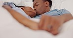 Marriage, love and black couple in bed kissing, intimate and bonding while in bedroom showing love, commitment and romance. Man and woman sharing a kiss and feeling happy in a healthy relationship