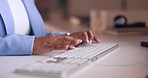 Hands, typing and keyboard with a business woman at work at her desk on a report or email in the office. Computer, writing and internet with a female employee busy while working on a desktop