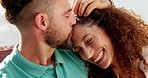 Love, smile and kiss, a couple on sofa happy and spending romantic quality time together in living room in Israel. Romance, relationship affection and relax at home, a man kissing woman on head.