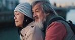 Retirement, hug and asian couple view building together on relaxing sightseeing holiday in Taiwan. Love, care and support of elderly people enjoying romantic embrace on vacation break at dock.
