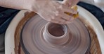 Woman, pottery and hands with in studio to design, relax or work on sculpture, project or artwork. Creative, artist and clay on hand to make pot, vase or art in hobby, job or career in workshop