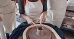 Art, learning and people in a pottery class with a young potter in a workshop for diverse people. Design, texture and creative lesson with help from young woman discussing mold and shape process