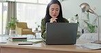 Web design, planning and business woman reading an email on a laptop while working on a website in an office at work. Designer, employee and creative worker thinking of a strategy with the internet 