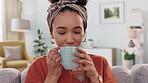 Woman, drinking coffee or relax on living room sofa in new house or home as real estate homeowner. Smile, happy or laughing person with tea after mortgage loan approval or property investment success