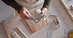 Clay, creative and pottery with hands of woman sculpting at ceramics workbench for art, design and workshop studio. Craftsman, artist or entrepreneur molding vase for hobby or small business 