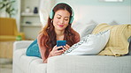 Relax, music and phone with woman in living room and headphones listening to radio, podcast or podcast. Happy, freedom and internet with girl on sofa, streaming for audio, social media or online