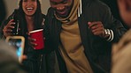 Party, friends and dance with a black man having fun, playing and drinking outside with a friend group. Happy, laughing and joking with a young male dancing at a celebration event in the night