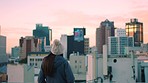 Girl, city and buildings with sunset in sky outdoor for peace, breathing and calm with clouds. Woman, roof or balcony for urban skyline, skyscraper or architecture to relax mind on rooftop in Toronto