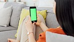 Green screen smartphone, mockup and sofa woman relax in living room with mobile app advertising, brand and digital marketing space. Hands, cellphone tech and social media, multimedia and web design 