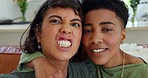 Lesbian couple, comic and phone selfie of black women taking a picture with a comedy and funny face. Portrait of girlfriend with mobile technology showing a love, care and silly faces on a house sofa