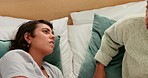 Lesbian couple,  fight and argue while tired in bed with unhappy relationship or marriage with angry communication in bedroom. Stress of lgbt women tired and frustrated in conflict conversation