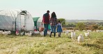 Family, mother and father with child on a chicken farm in nature to harvesting eggs, poultry and livestock together. Sustainability, agriculture and farmer farming with wife and kid in rural Medellin