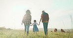 Farm, parents and child walking in the countryside while farming, holding hands and bonding. Agriculture, sustainability and agro man farmer with family in eco friendly, sustainable and ecology field