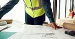 Hands of architect check blueprint at construction site for building, house or real estate industrial development. Architecture industry man, engineer and contractor inspection of project design plan