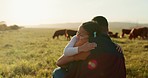 Love, family and cow with a father and girl hug in a field outdoor on a farm. Cattle farmer and little kid in the farming, agricultural and dairy industry on a meadow or pasture outdoors in sunset