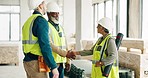 Handshake, architecture and engineering team shaking hands with a project development designer in a building. Global, b2b and happy construction workers in meeting or partnership deal with contractor