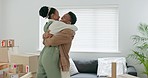 Love, dance and property with couple and box in living room for real estate, moving and mortgage. Freedom, investment and future with man and woman in home for growth, happy and goals in new house