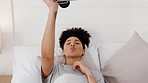 Camera, pouting and woman with a photo on a bed in a house to relax and film in the morning. Young, happy and funny girl with a picture of her face on a retro and vintage camera in the bedroom