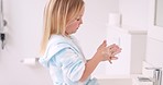 Girl washing her hands in the bathroom of her home for hygiene, stop germs and prevent bacteria. Healthcare, clean and young child doing sanitary routine with soap and water in the basin at her house