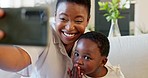 Selfie, mother and girl with phone, kiss and hug in living room on sofa smile, together and happiness on smartphone. Happy black woman and kid love internet, online and social media picture in home