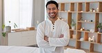 Spa, luxury and Asian man in massage therapy at a salon for wellness, health and skincare for body. Portrait of a happy, relax and therapist with a smile, arms crossed and pride in physical therapy