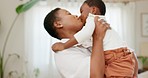 Black woman with baby are playful, kiss and hug, love and fun together, bonding at home in living room. Mother, child and play, laugh and spending quality time for childhood and parenting.