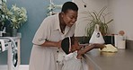 Black woman, mother and child learning cleaning a house together for tidy housekeeping, dusting and spring cleaning task. Teaching, child development and girl helping or working with her mama or mom