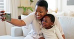 Smartphone, selfie and mother with child on living room sofa for social media post, parents blog update or family home celebration. Black family smile in cellphone portrait photography for online app